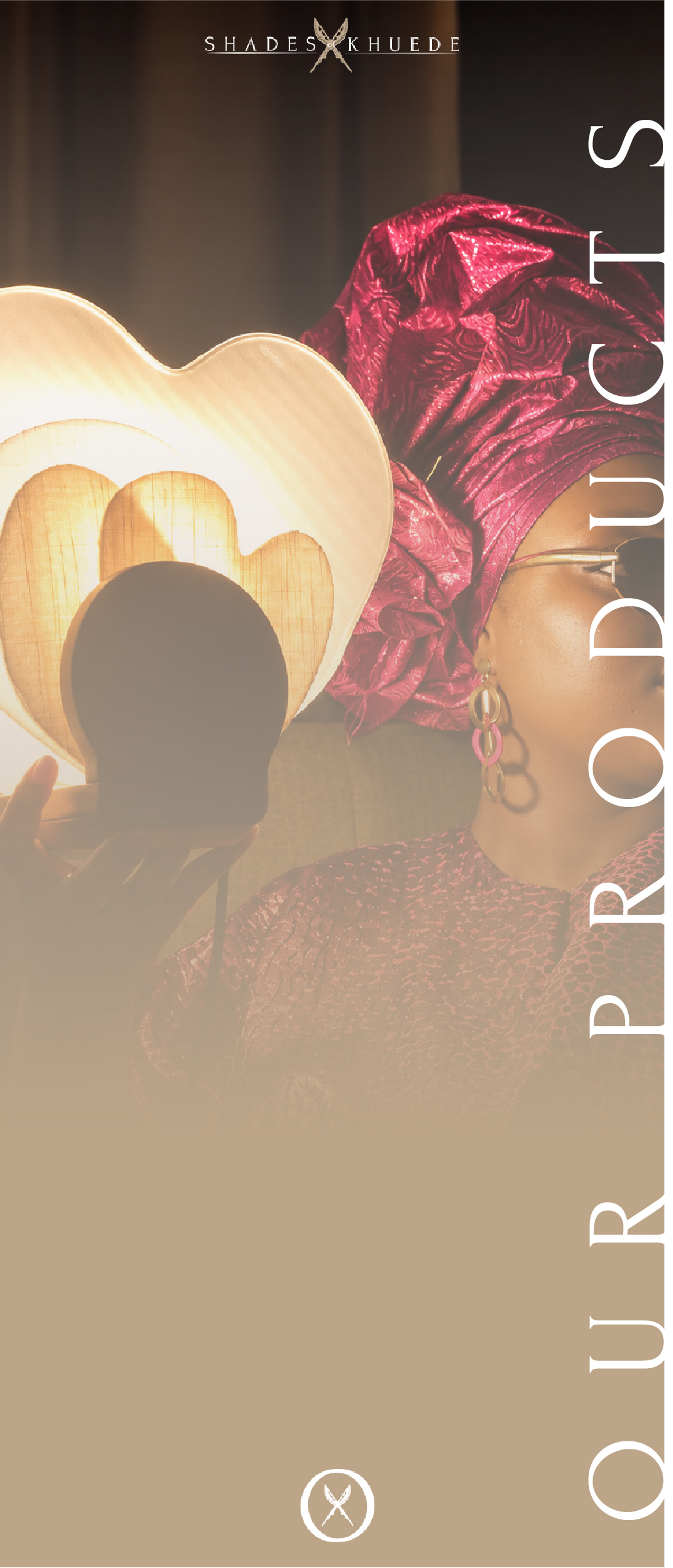 Shades of Khuede’s Diba-Gele concept image, showing a woman in a red gele holding the glowing lamp